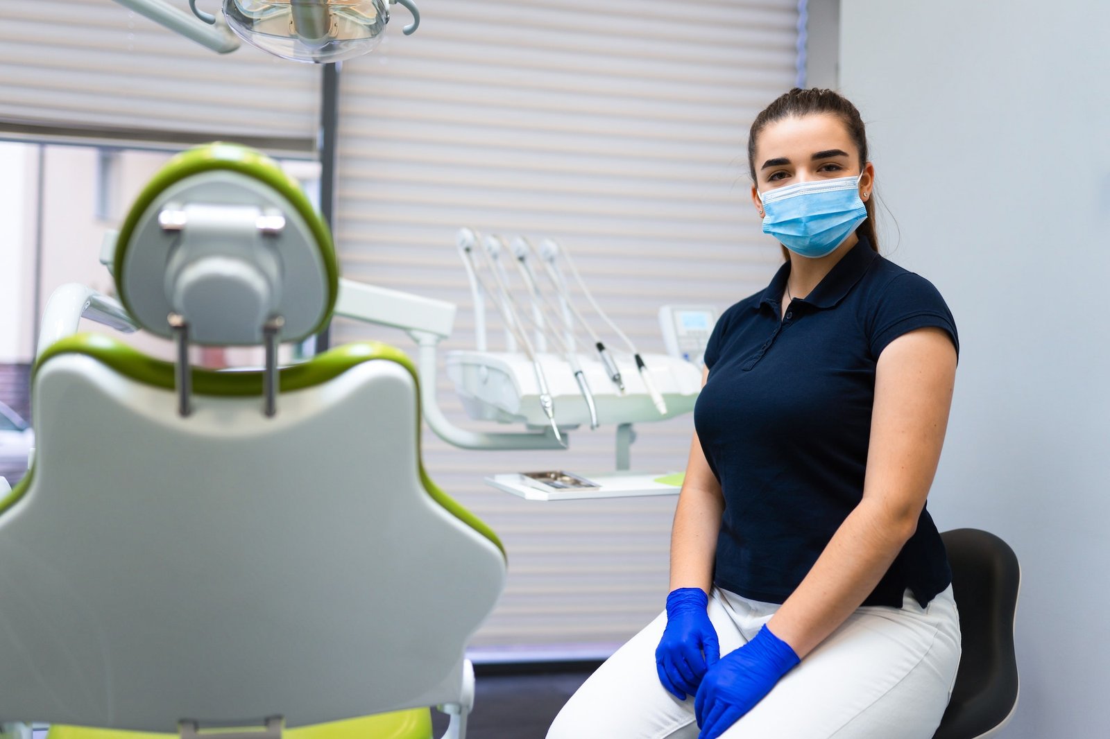 Portrait of woman dentist who sitting in office